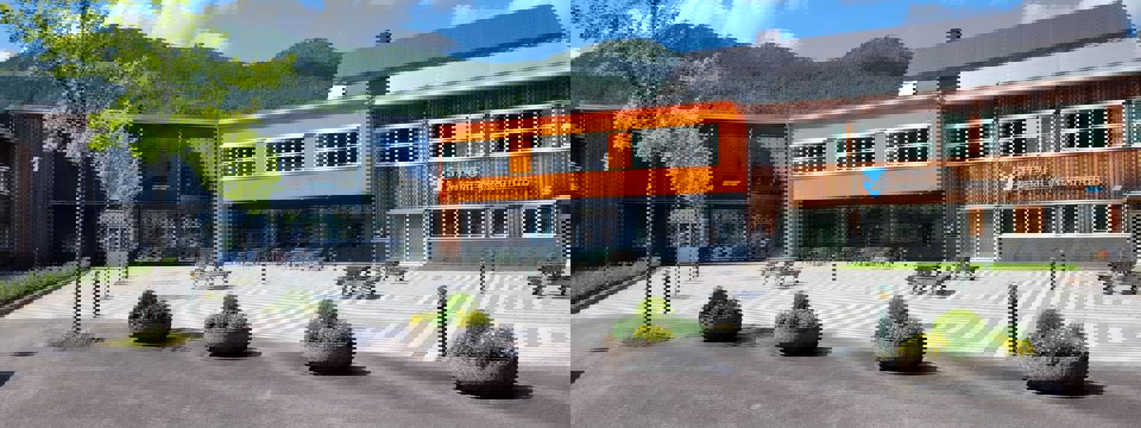 Bilde av austsida på Stryn vgs ein sommardag. Foto: Stryn vgs